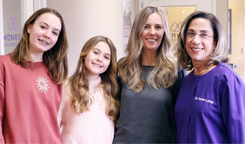 dr. leiva and patients smiling